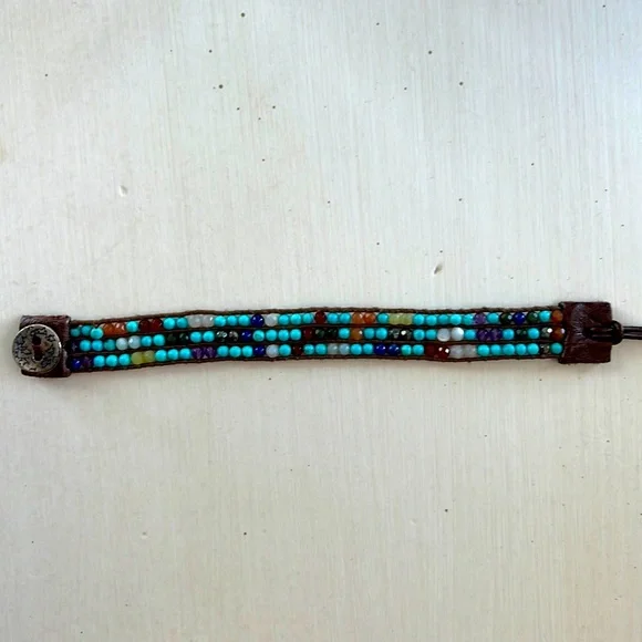 Multicolored gemstone leather wrap bracelet.